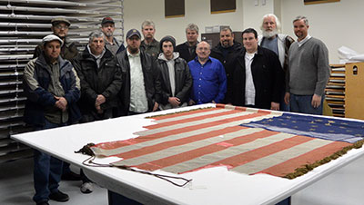 Photo of group visiting Michigan's battle flags held by Save the Flags. Photo ©2014 William Eichler.